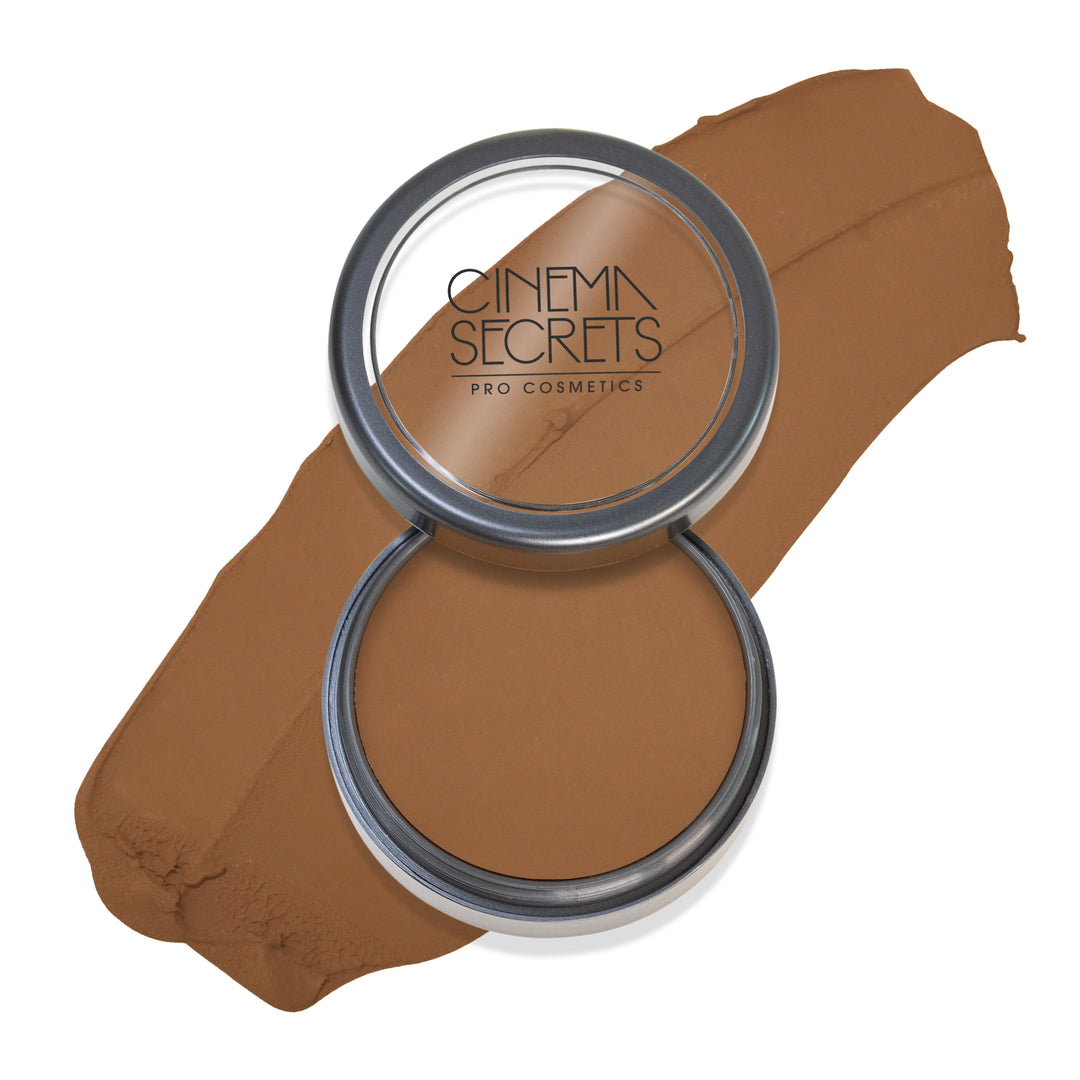 Round open compact of foundation with color swatch