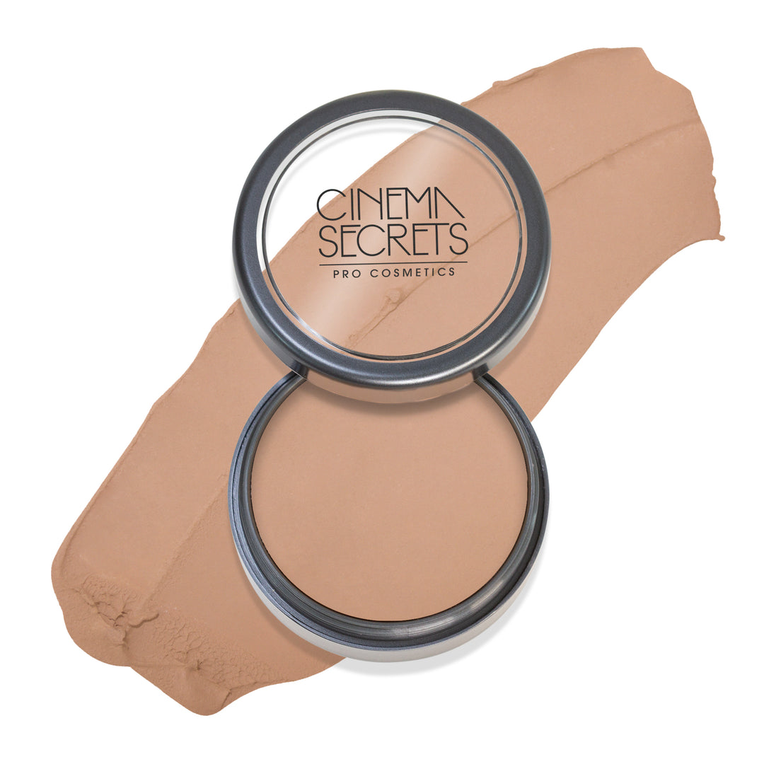 Round open compact of foundation with color swatch