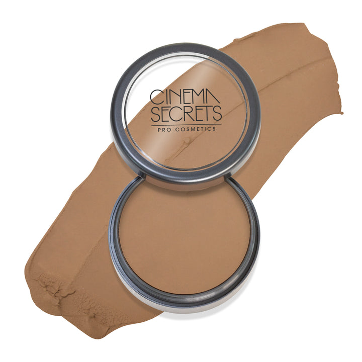 Round open compact of foundation with color swatch