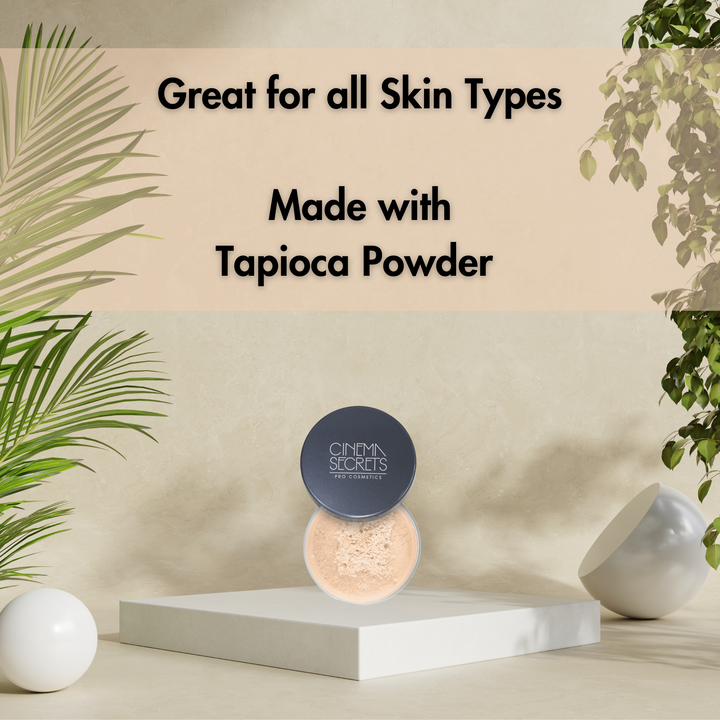 open compact of face powder on white riser and tan background with leaves