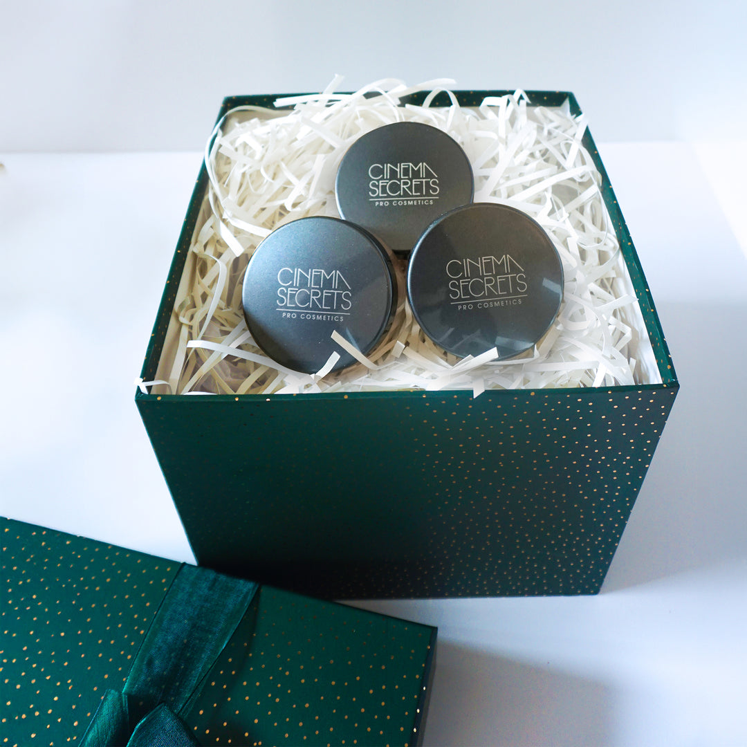 Three 'Cinema Secrets' products in a green box with a white interior
