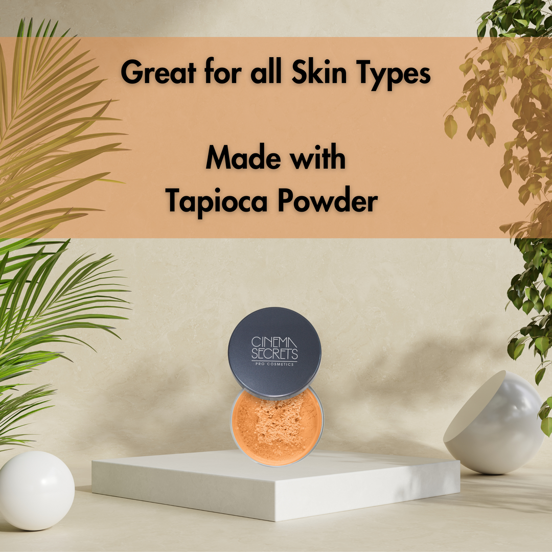 open compact of face powder on white riser and tan background with leaves