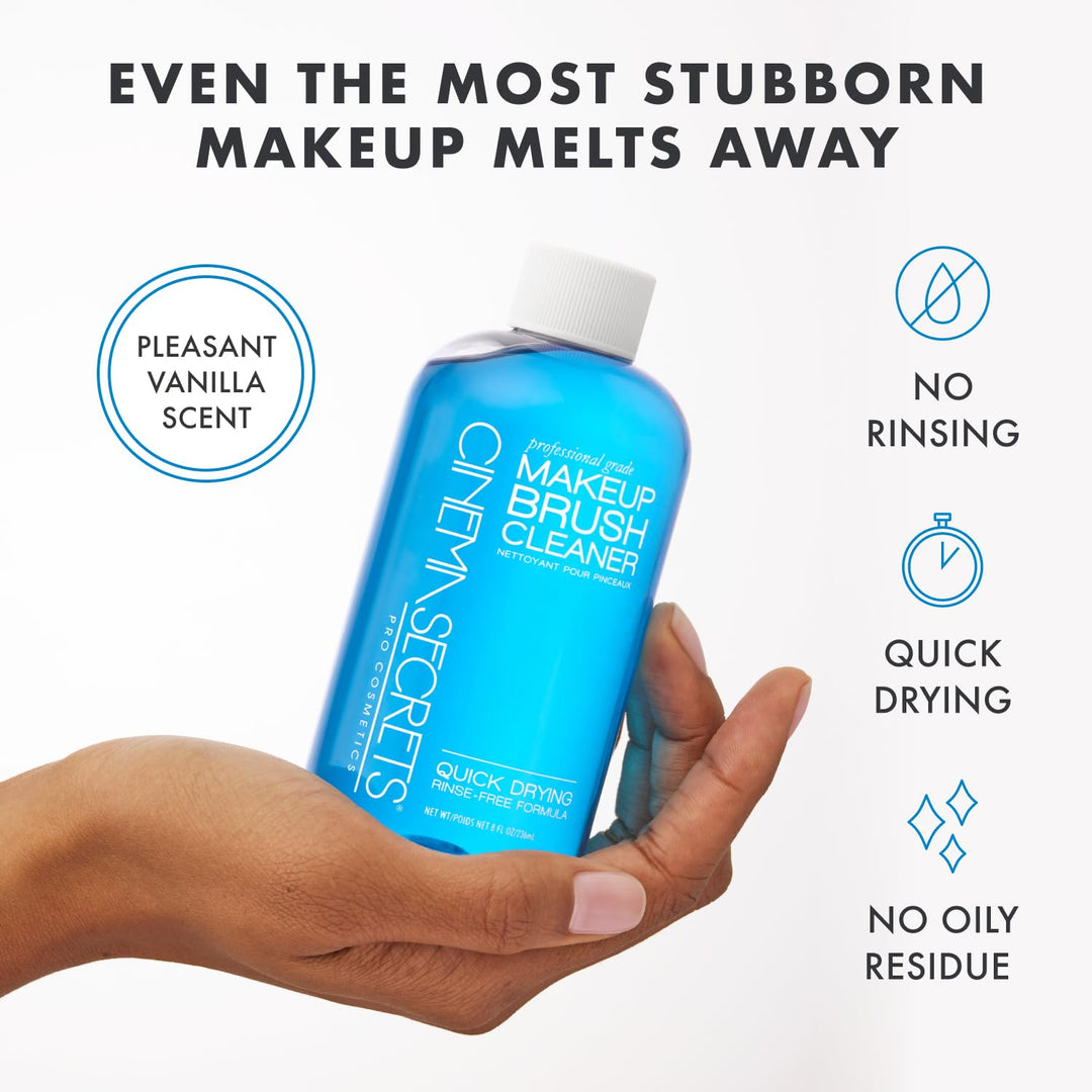 Blue makeup brush cleaner bottle held in a hand with product features listed on a white background