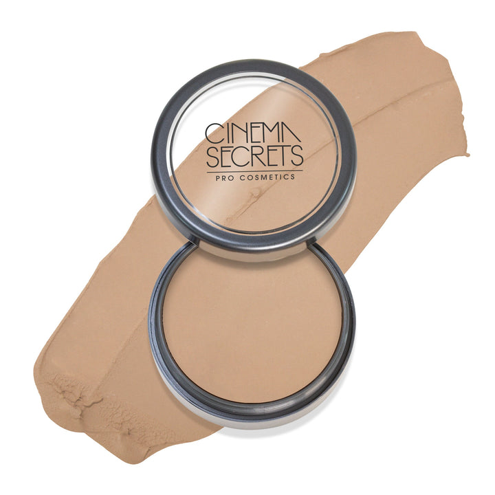 Round open compact of foundation with color swatch