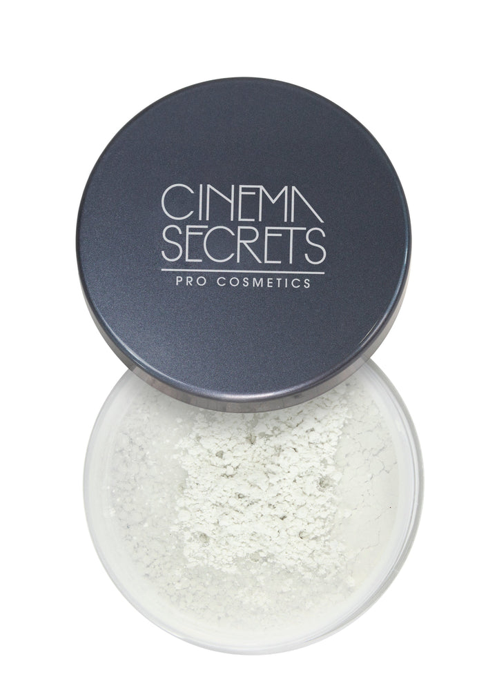 open compact of face powder on white background