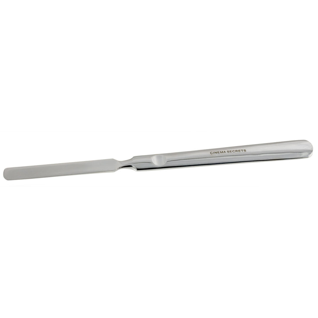 metal makeup spatula on a white background